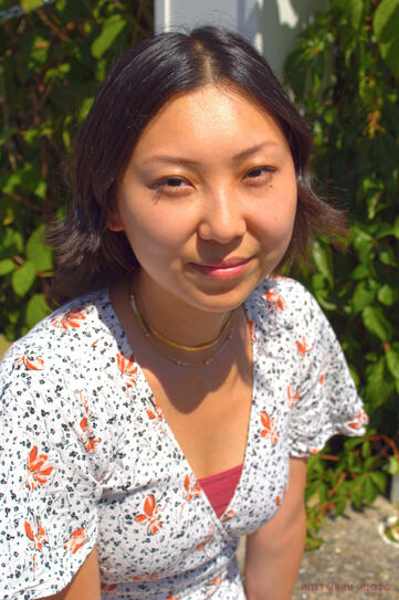 Headshot of Abbie Van Lee with a warm undertone.